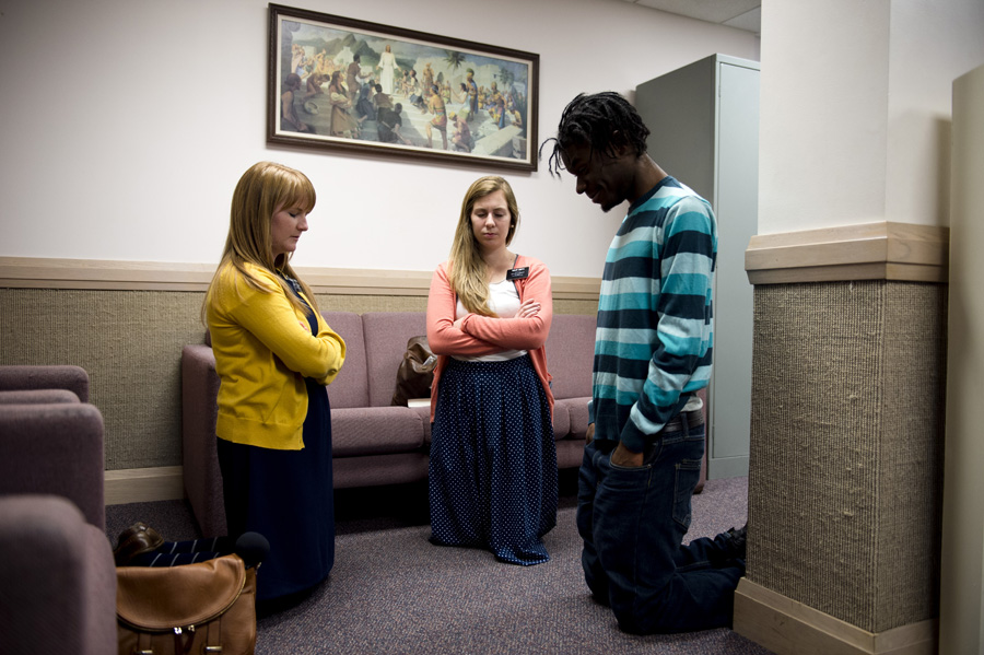 Sister Landeen & sister Smith giving a lesson to a potential new member of the Mormon Church.