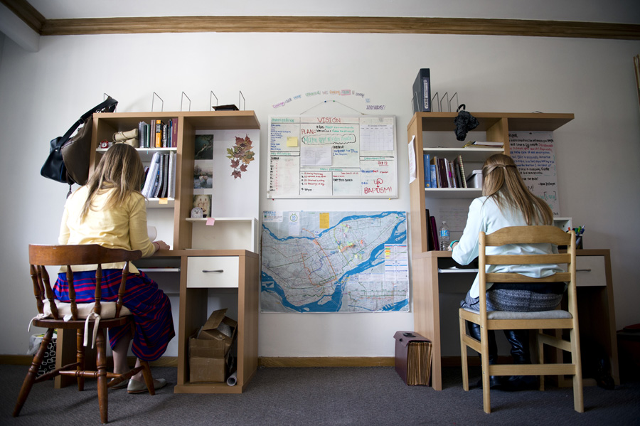 Sister Smith & sister Landeen studying at home.