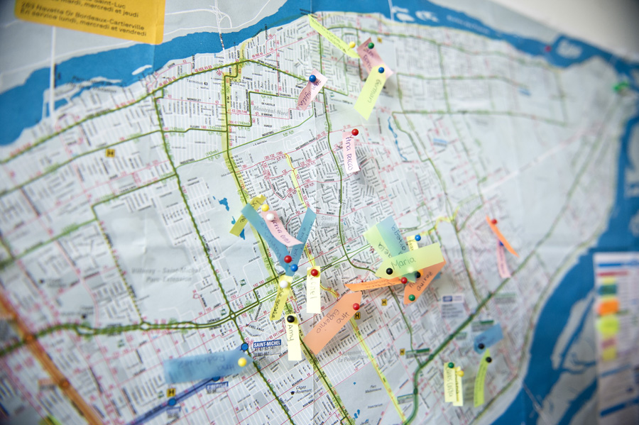 The sisters use a map to plan their time effectively. Blue tags are for members of the Church, orange is for recent converts, yellow is for investigators and pink represents the less active members.