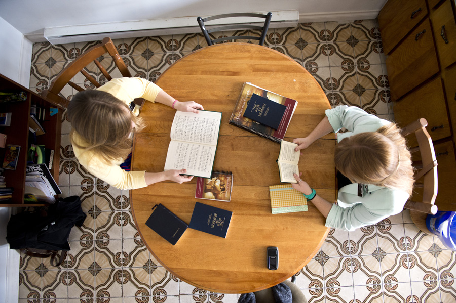 Sister Smith & sister Landeen singing religious songs at home.