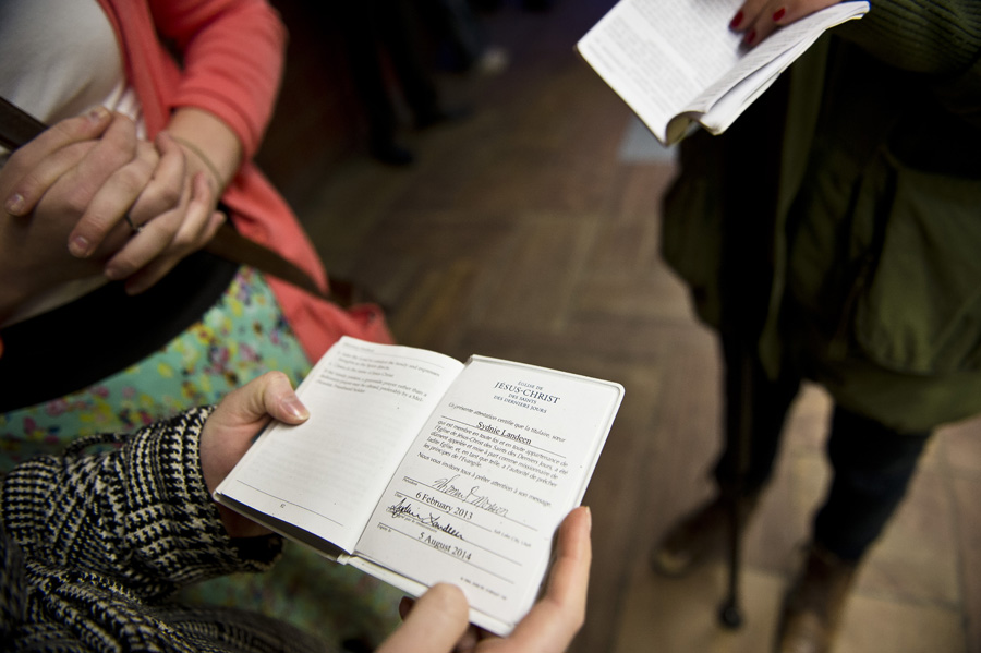 Sister Landeen opening her missionary book in the Metro. The missionary book is an insight of all the strict rules missionaries have to follow.The sisters have it with them at all times.